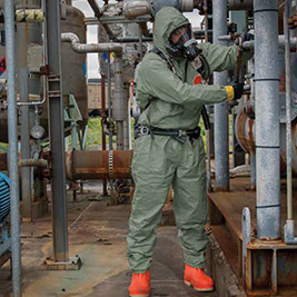 Refinery workers wear green Tychem 2000 SFR flame resistant-disposable hooded protective coveralls