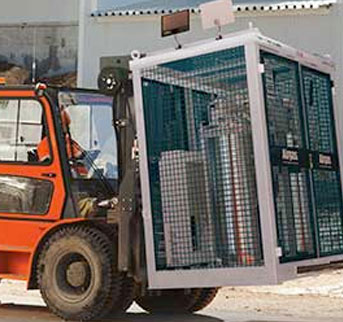 A forklift moving a jobsite skid on a construction site