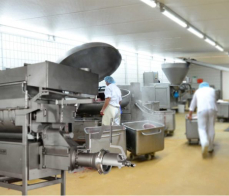 Food manufacturing floor featuring food-freezing equipment utilizing bottom injection.