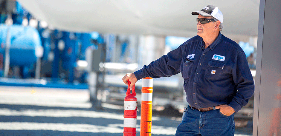 An Airgas associate outside at an Airgas filling plant.